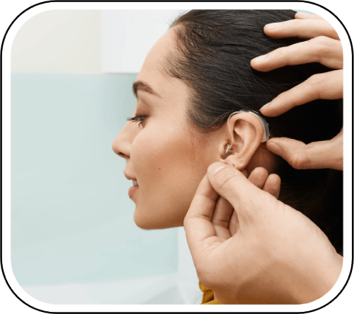 Doctor caring for patient's ear