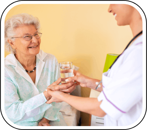 Nurse providing assistance to elderly lady